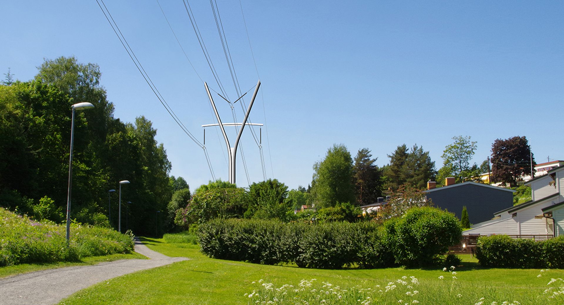 Y shaped transmission tower surrounded by green trees, under clear sky