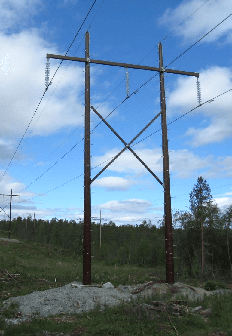 A giant transmission tower under cloudy sky