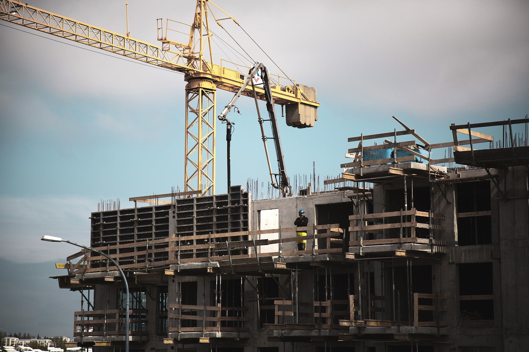 Yellow dragline excavator in a building construction site 