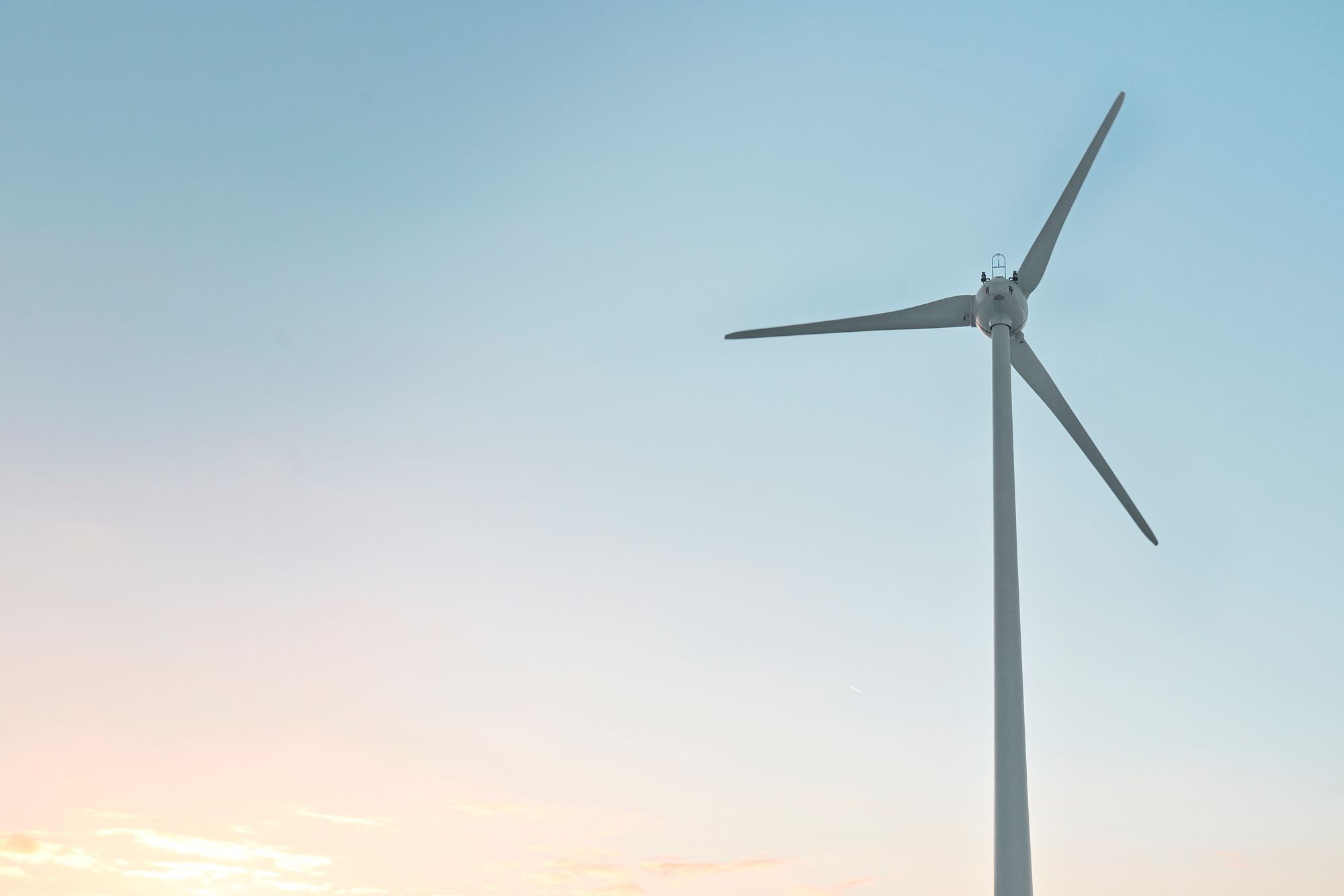 a wind power under blue sky